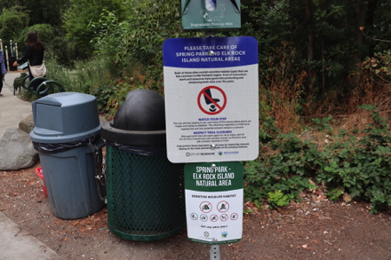 Park rules, dog waste bags and trashcan at park entrance